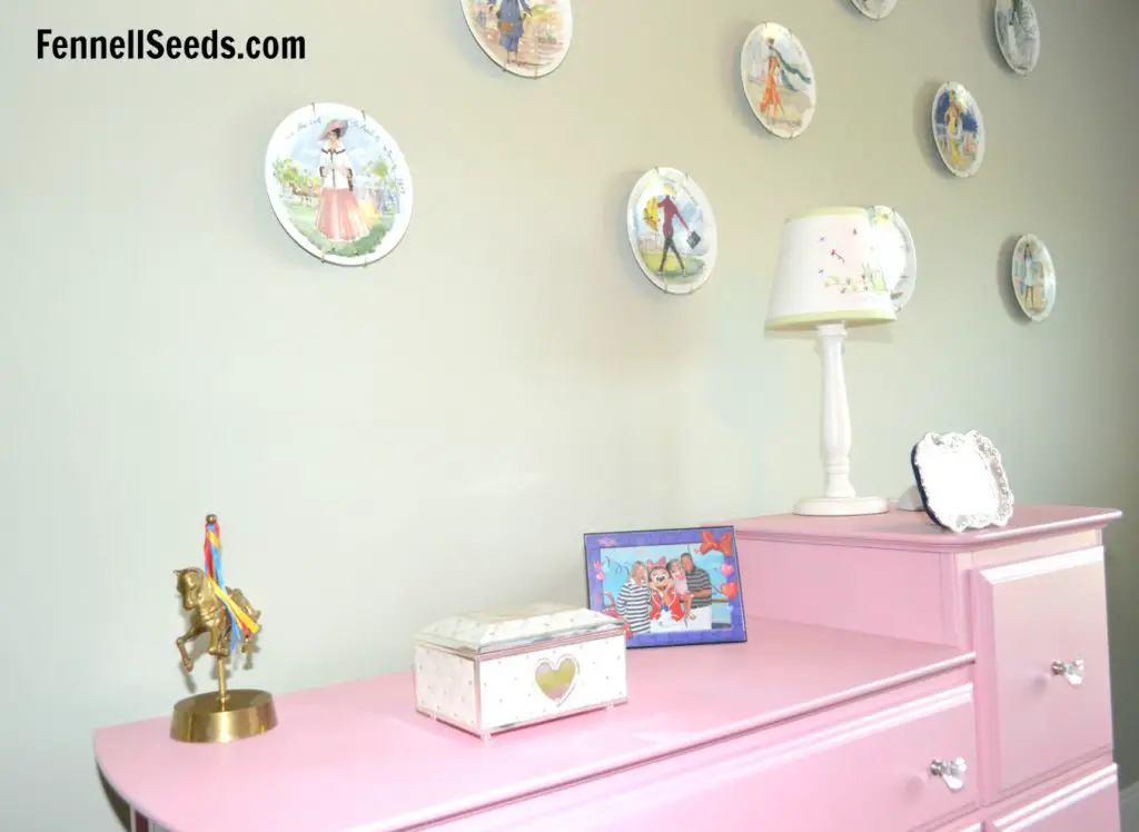 This dresser is spray painted pink. It was a diaper changing table and it was dressed up with spray paint and new knobs. 