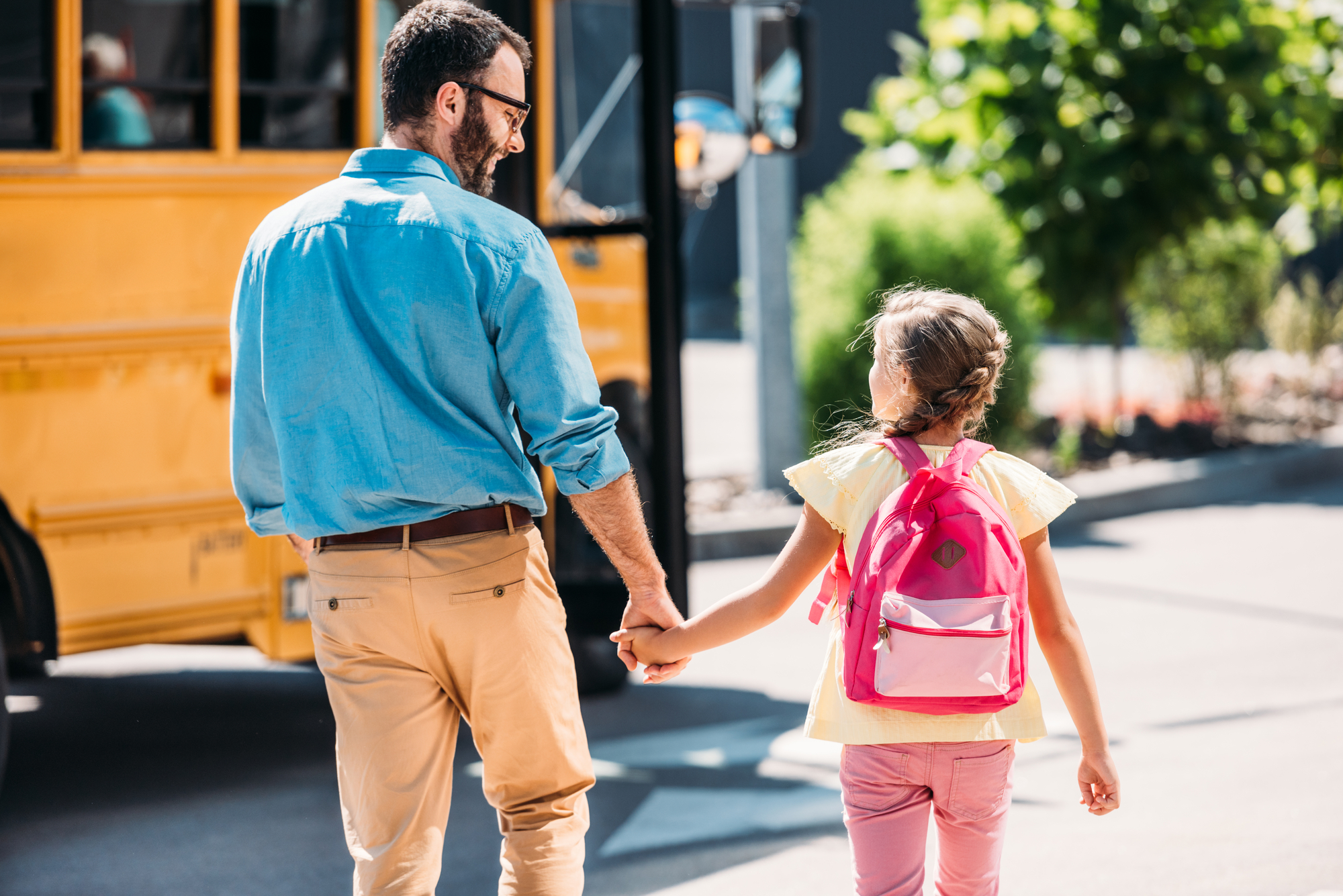 Father walking daughter to school - What age are you in 6th grade?