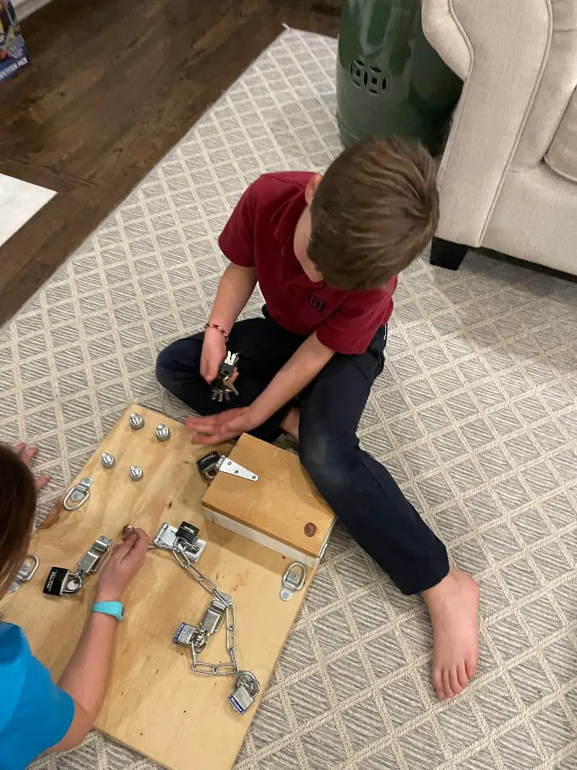 Photo of an Exciting DIY Montessori Busy Board for older kids to spend hours locking and unlocking.