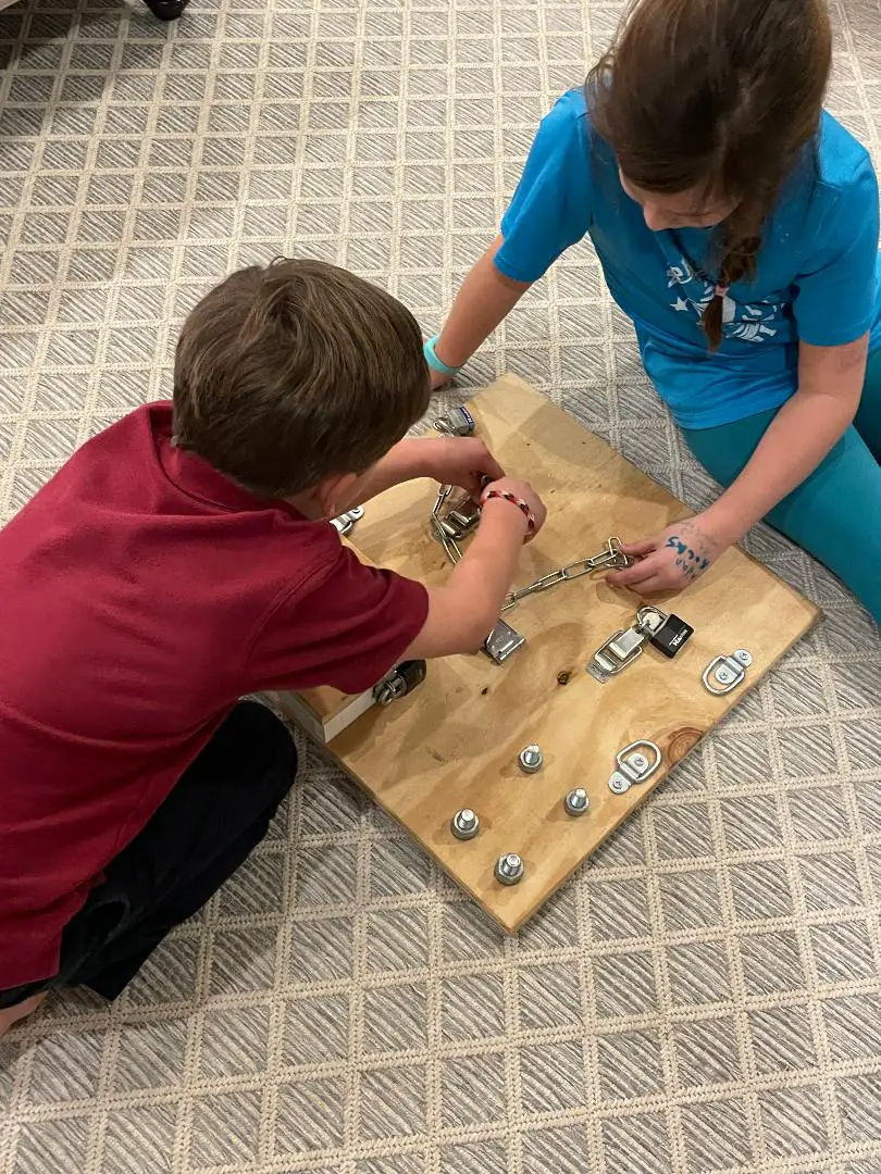Photo of an Exciting DIY Montessori Busy Board for older kids to spend hours locking and unlocking.