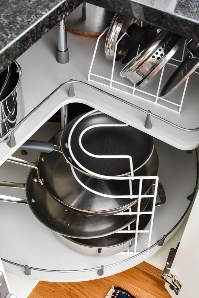 organized corner cabinet pots and pans